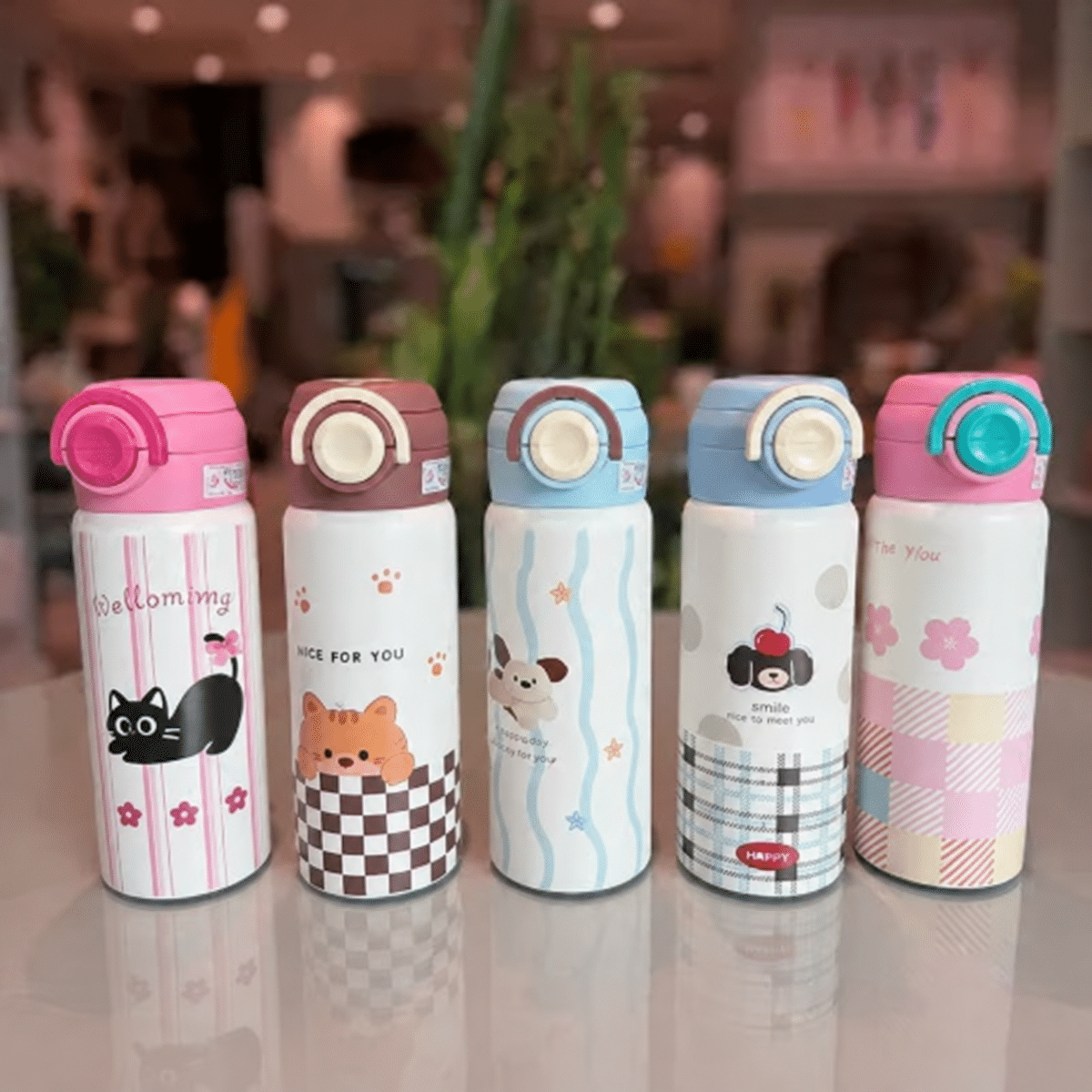 Five colorful cartoon travel bottles تراول دو درب 500 میل عروسکی - تصویر 1